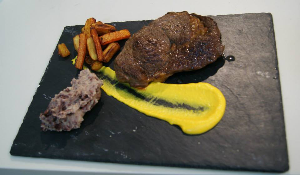 rib eye Aberdeen Angus, Stornoway black pudding, root vegetable chips and creamed carrot