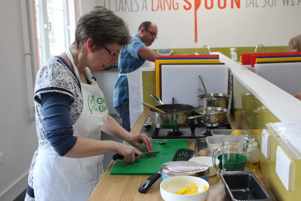 Vohn chopping wild garlic leaves